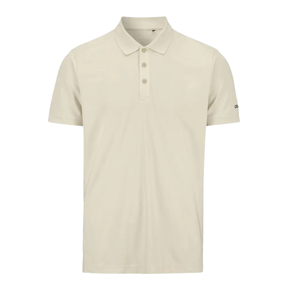 Craft CORE Unify Polo pikeepaita, vÀri Plaster (vaalea beige/luonnonvalkoinen). Laadukas pikee omalla logolla, kuva edestÀ.