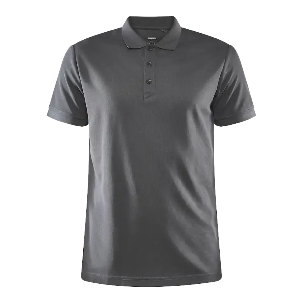 Craft CORE Unify Polo pikee, vÀri Granite (tummanharmaa). Pikee yrityksen logolla, kuva edestÀ.