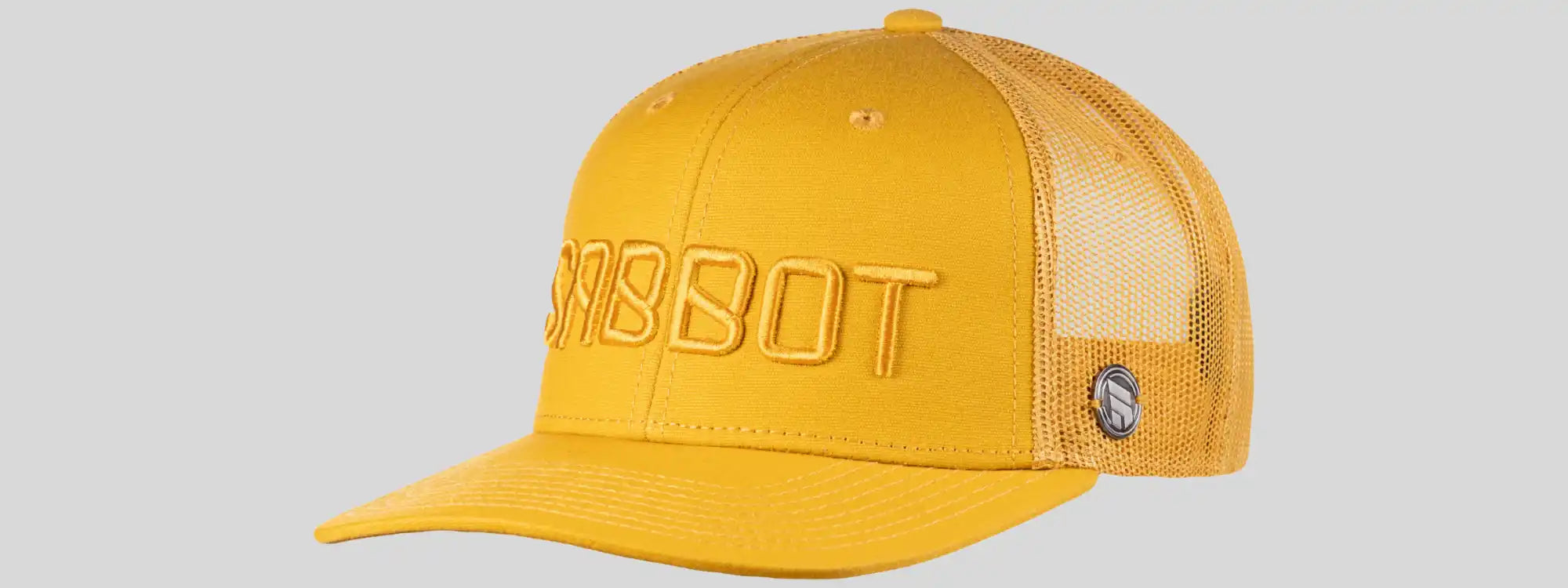 Keltainen verkkotakaosa snapback-pesäpallokapsi, jossa on 'SRSBOT' teksti brodeerattu eteen.